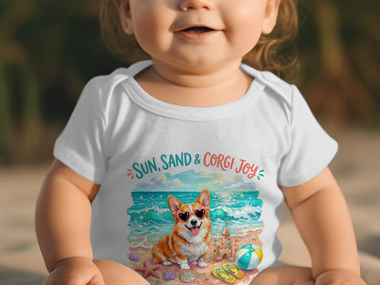 Baby wearing a white onesie with a corgi on a beach.