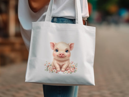 White tote bag featuring a cartoon piglet with flowers.