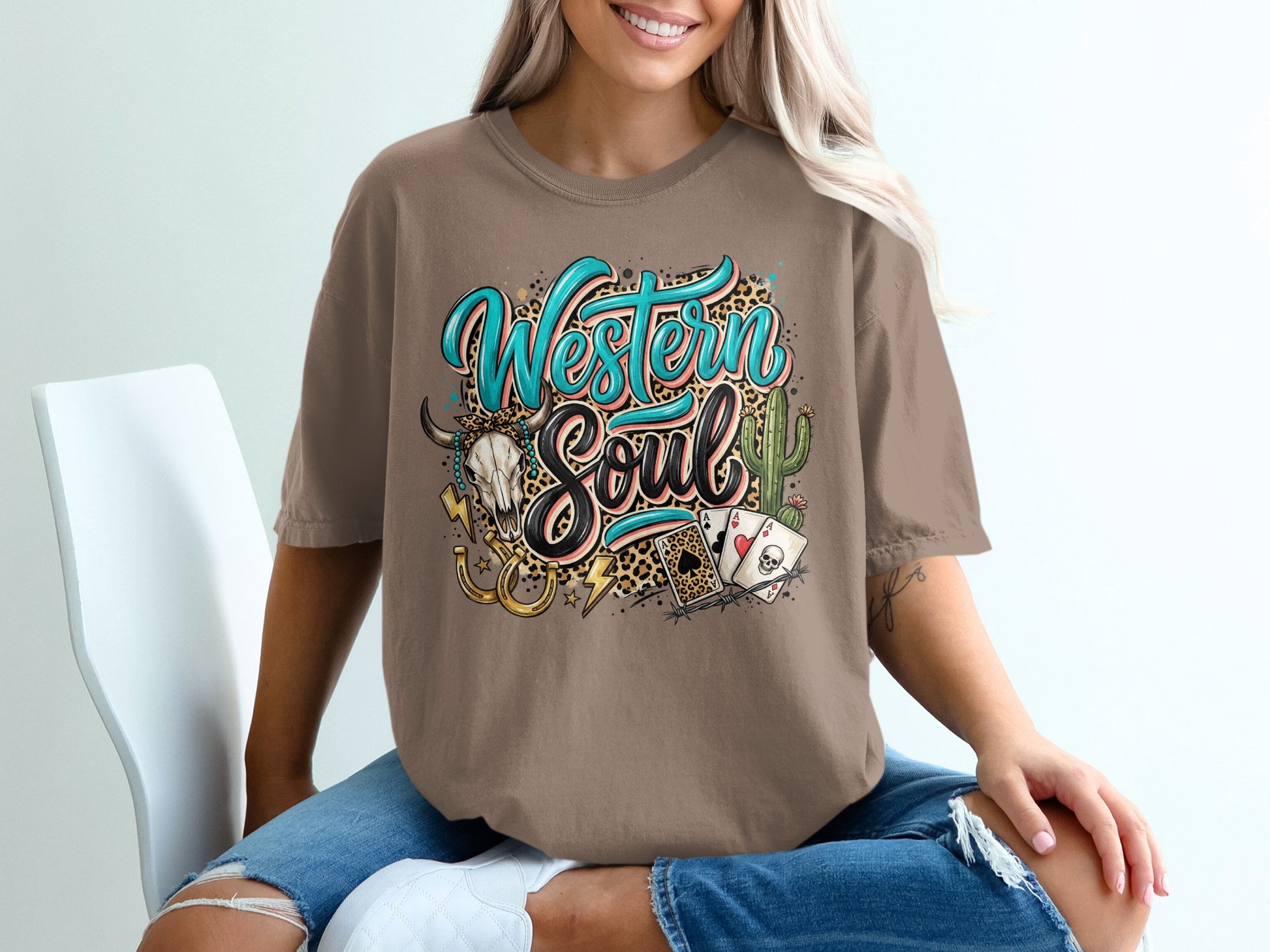 T-shirt with "Western Soul" graphic, skull, playing cards, horseshoe, and cactus.