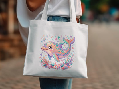 White tote bag featuring a colorful dolphin illustration with seashells and bubbles.