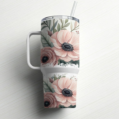 Pink floral pattern on a white tumbler with handle and straw.