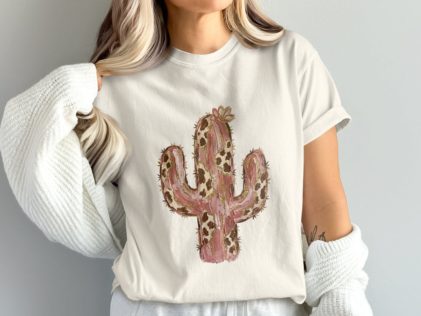 Cream t-shirt with a stylized watercolor cactus design.
