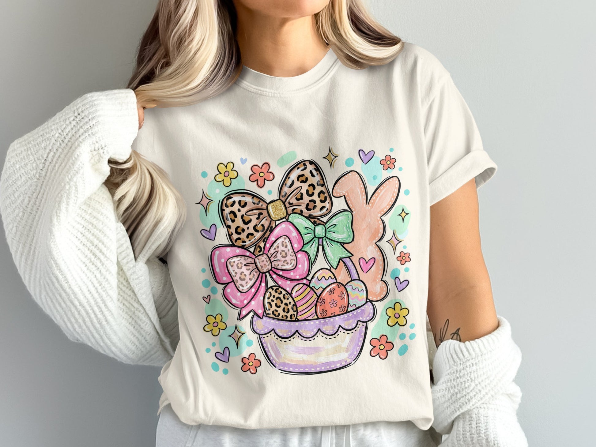 Easter basket with eggs, bunny, and bows, adorned with hearts and flowers.