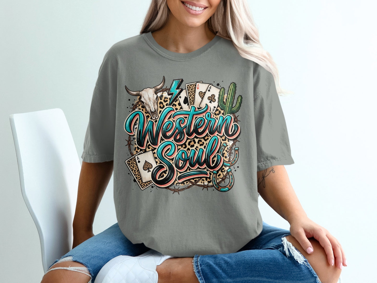 T-shirt with "Western Soul" text, playing cards, cactus, and skull graphic.