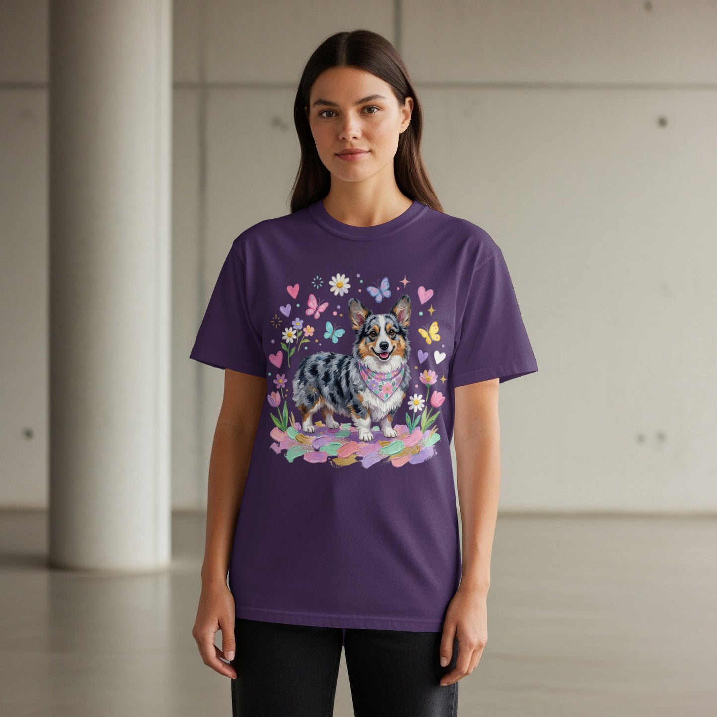 Woman wearing purple t-shirt with a corgi and colorful butterfly print.
