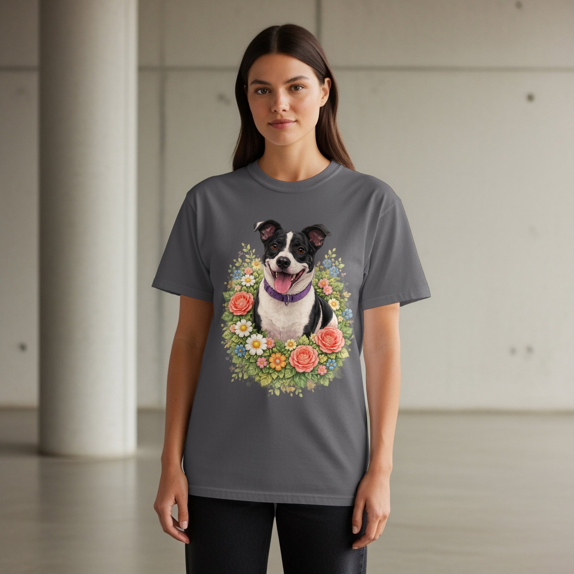 Woman wearing a dark gray t-shirt with a floral dog portrait.