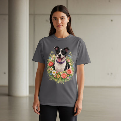 Woman wearing a dark gray t-shirt with a floral dog portrait.