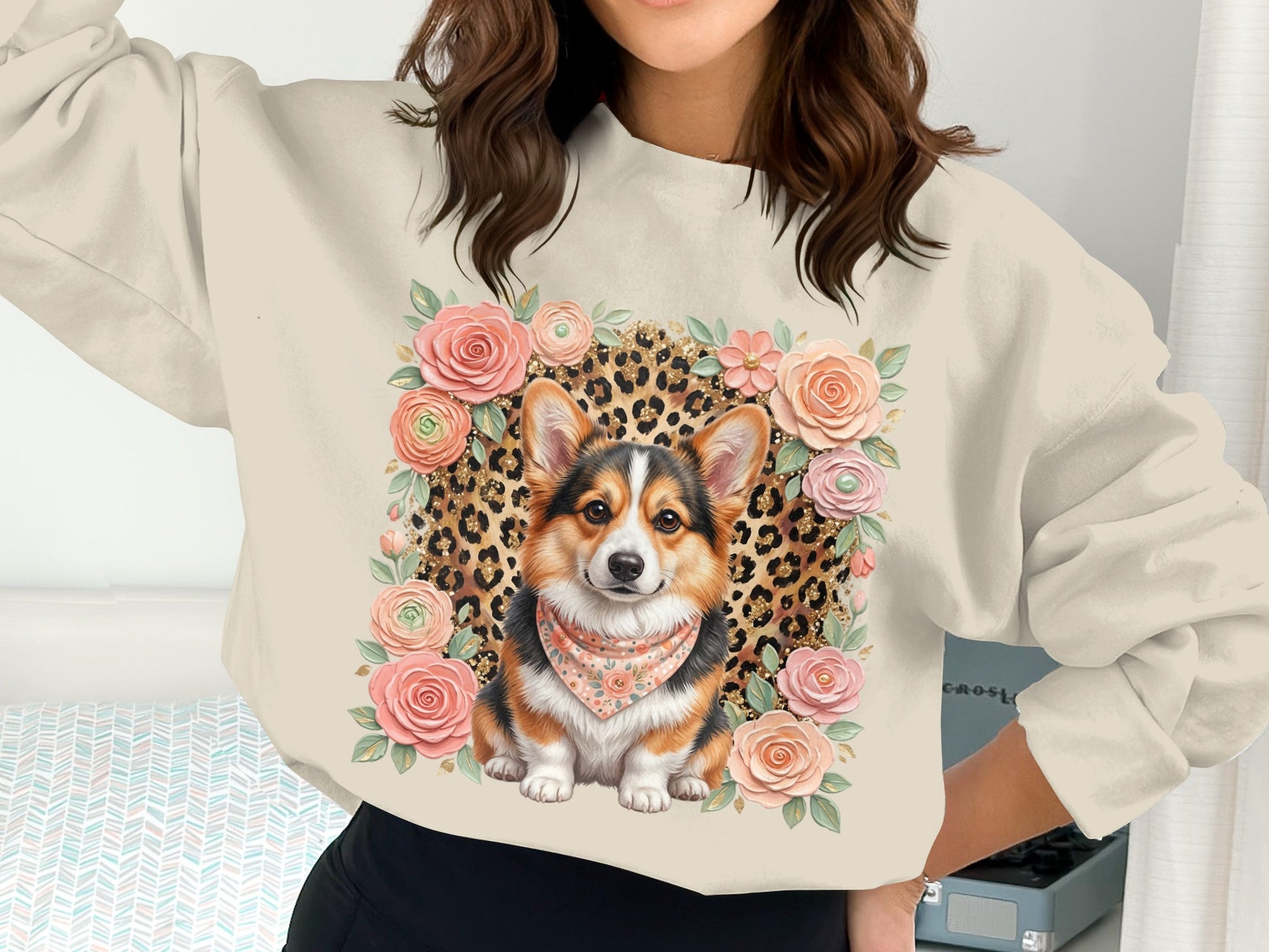 Cream sweatshirt with a corgi wearing a bandana surrounded by roses and leopard print.