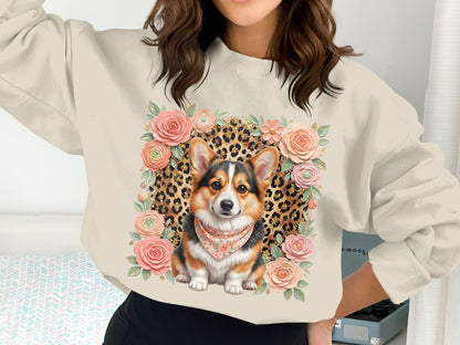 Cream sweatshirt with a corgi wearing a bandana surrounded by roses and leopard print.
