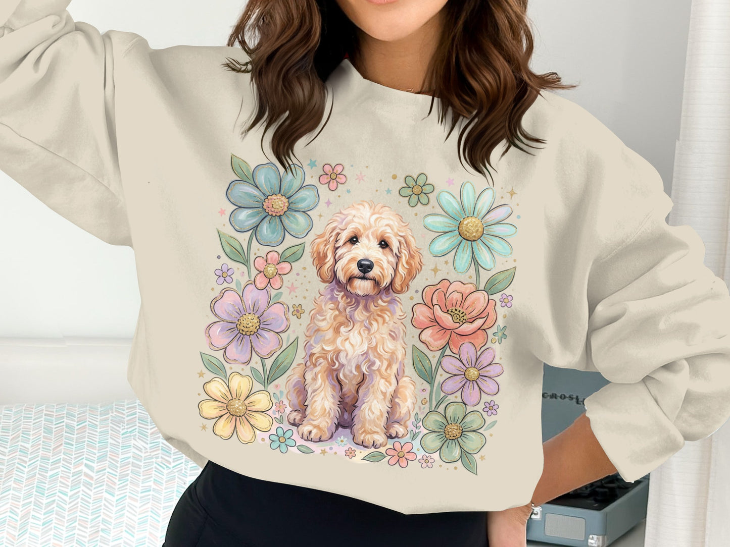 Cream sweatshirt with a golden doodle dog surrounded by pastel flowers.