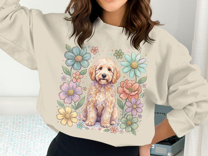 Cream sweatshirt with a golden doodle dog surrounded by pastel flowers.