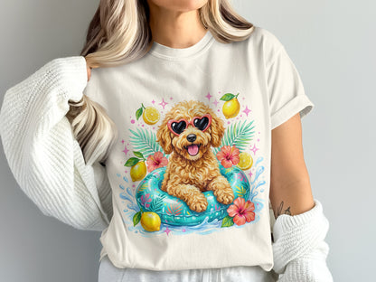 Cream t-shirt with a cartoon dog in sunglasses on a float.