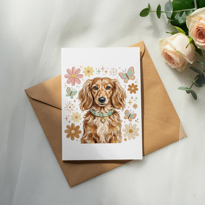 Dachshund wearing a floral collar on a greeting card with butterflies and flowers.