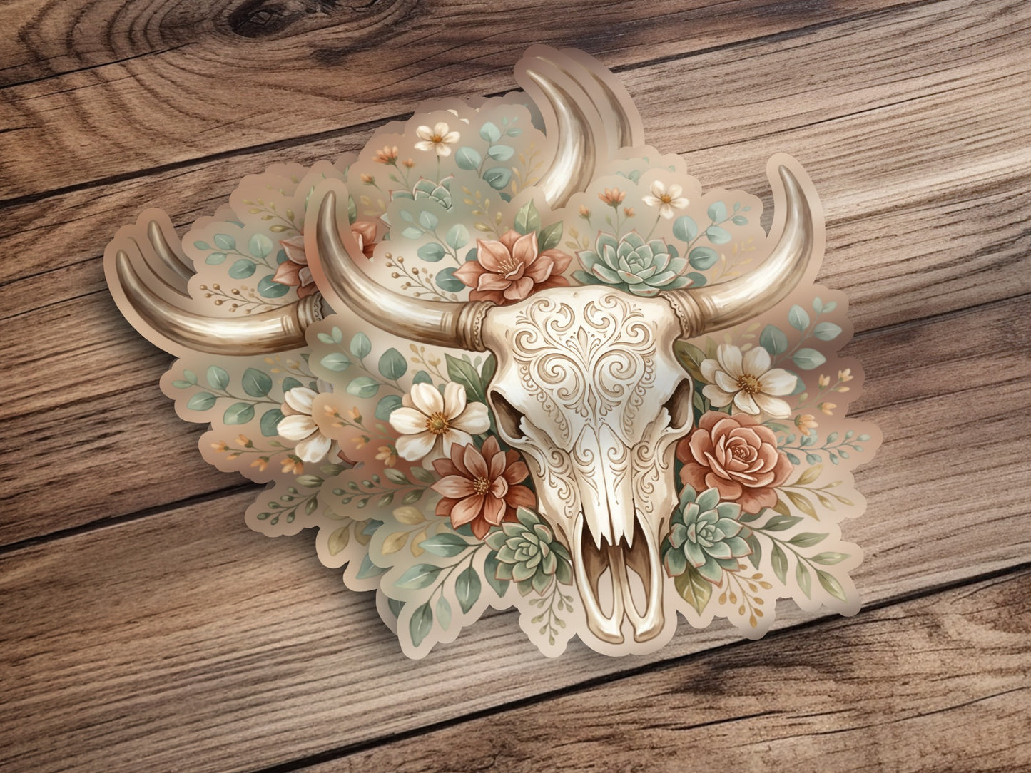 Decorative bull skull with floral accents on wooden background.