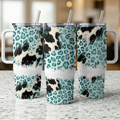 Three tumblers with cow print and teal leopard pattern.