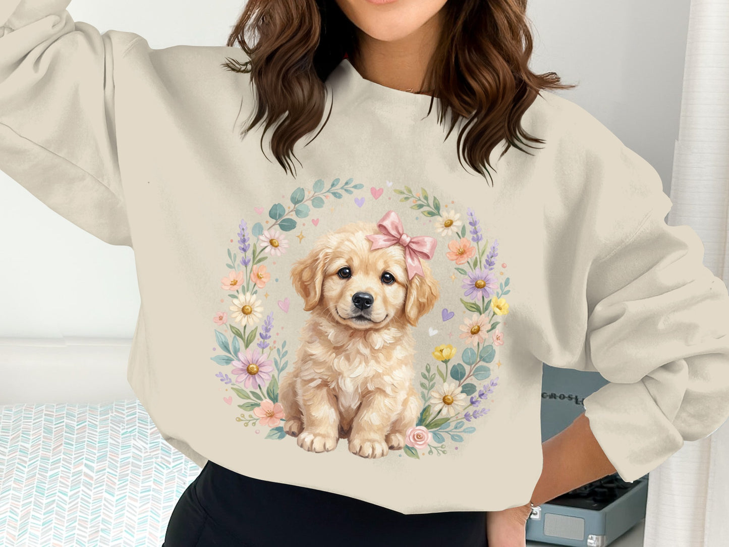 Golden retriever puppy wearing a pink bow in floral wreath.