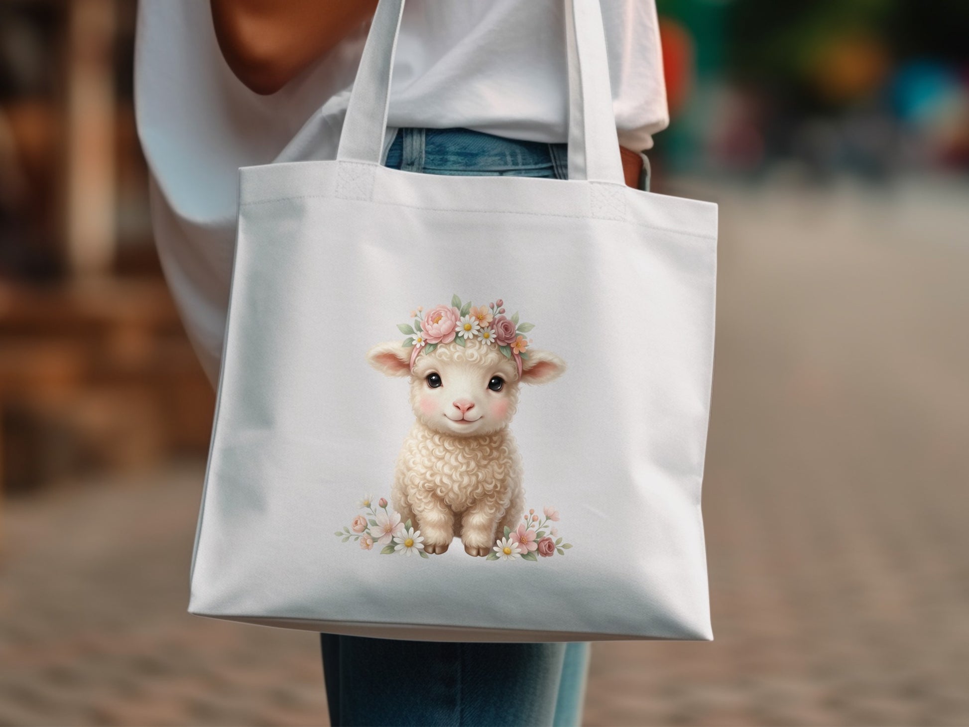 White tote bag with a cartoon lamb wearing a flower crown.