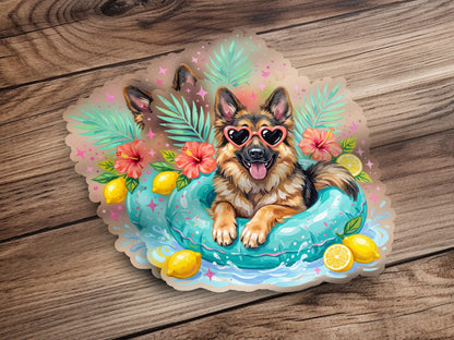 German Shepherd wearing heart sunglasses floats in pool with lemons and flowers.
