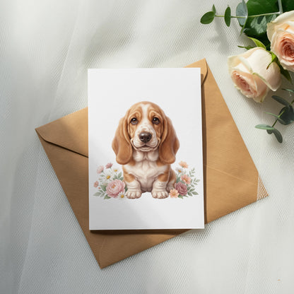 Basset hound puppy on a card with flowers, on a brown envelope.
