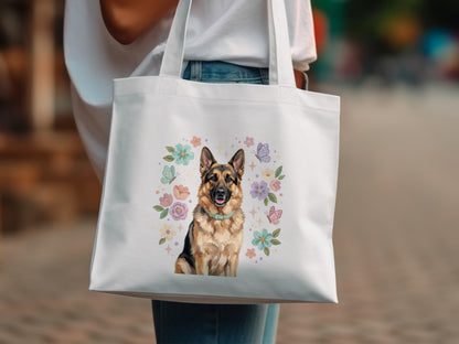 German Shepherd dog with floral and butterfly accents on a white tote bag.