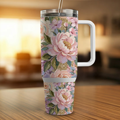 Floral tumbler with handle and straw, featuring pink peonies and glitter accents.