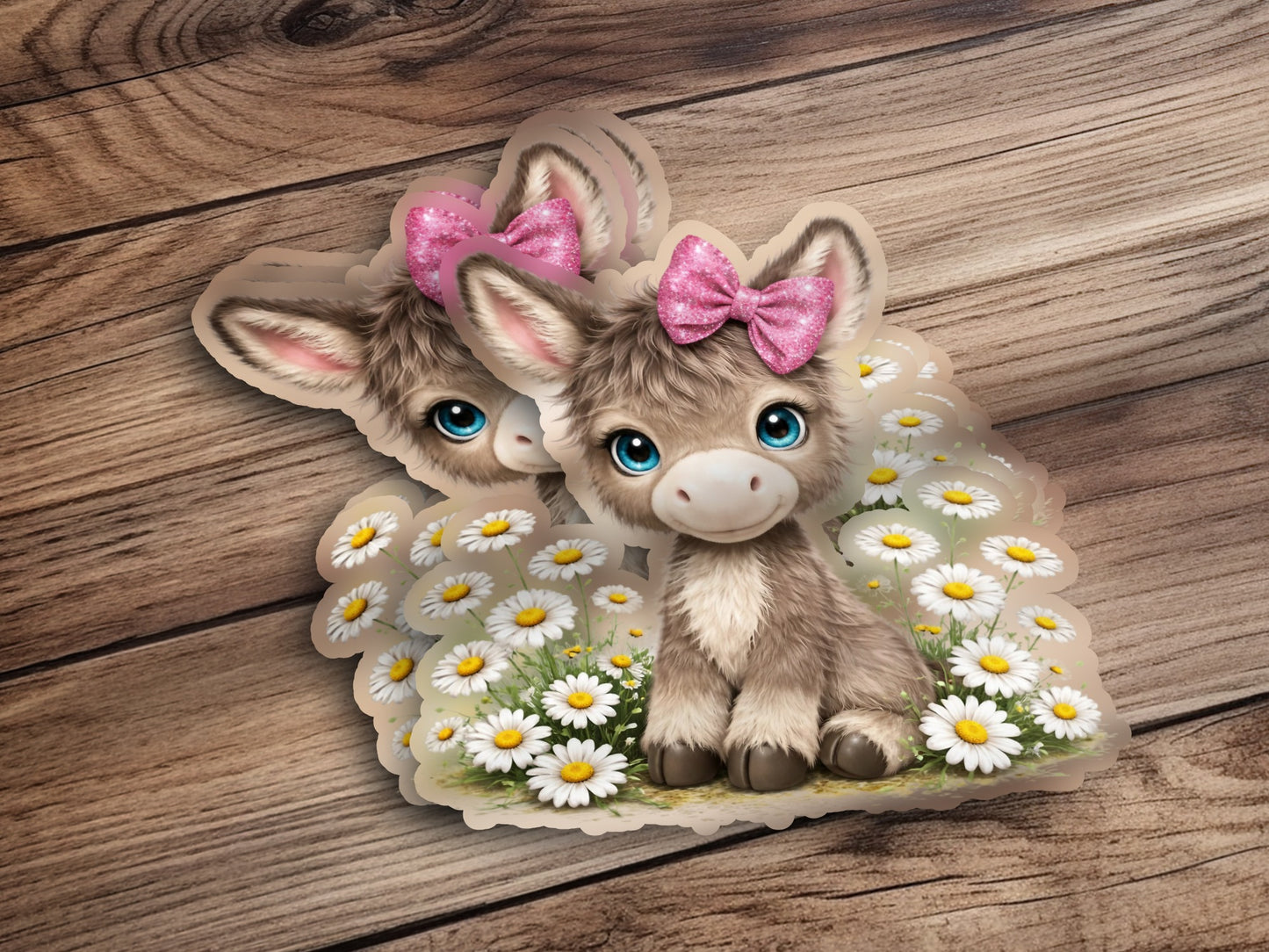 Cute donkey sticker with pink bow in field of daisies.