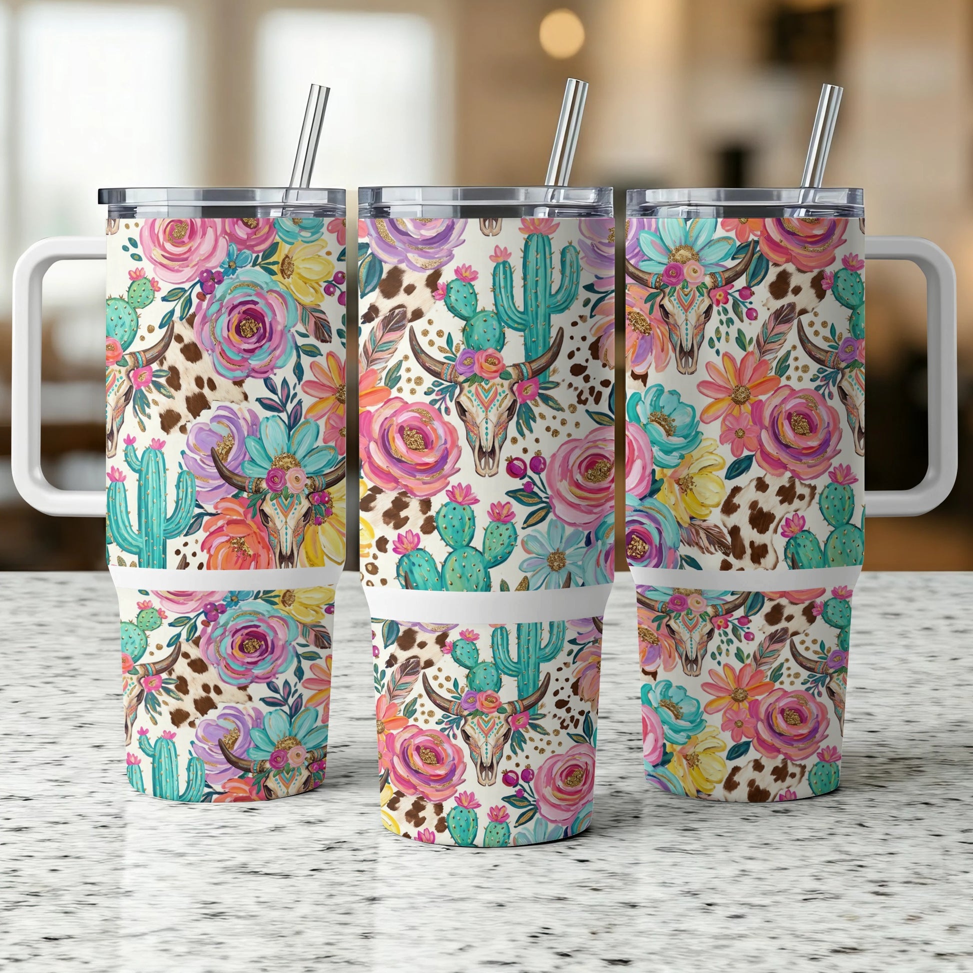Three tumblers with a floral and cow skull western design.