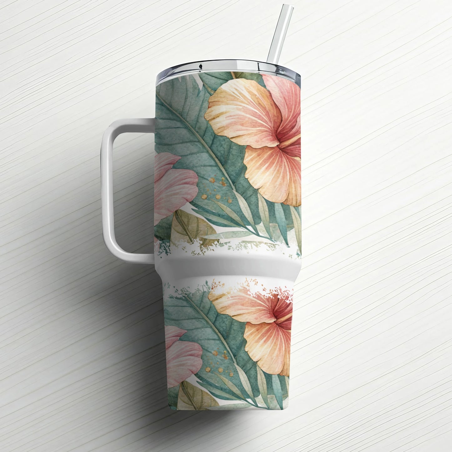 Tropical hibiscus floral pattern on a white insulated tumbler with straw.