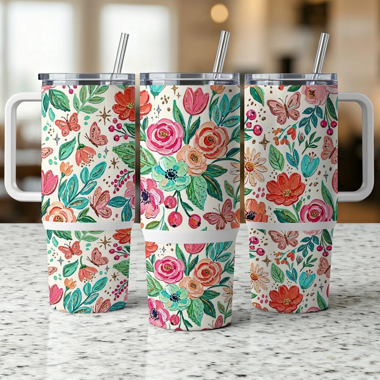 Three tumblers with floral butterfly design, stainless steel lids, and straws.