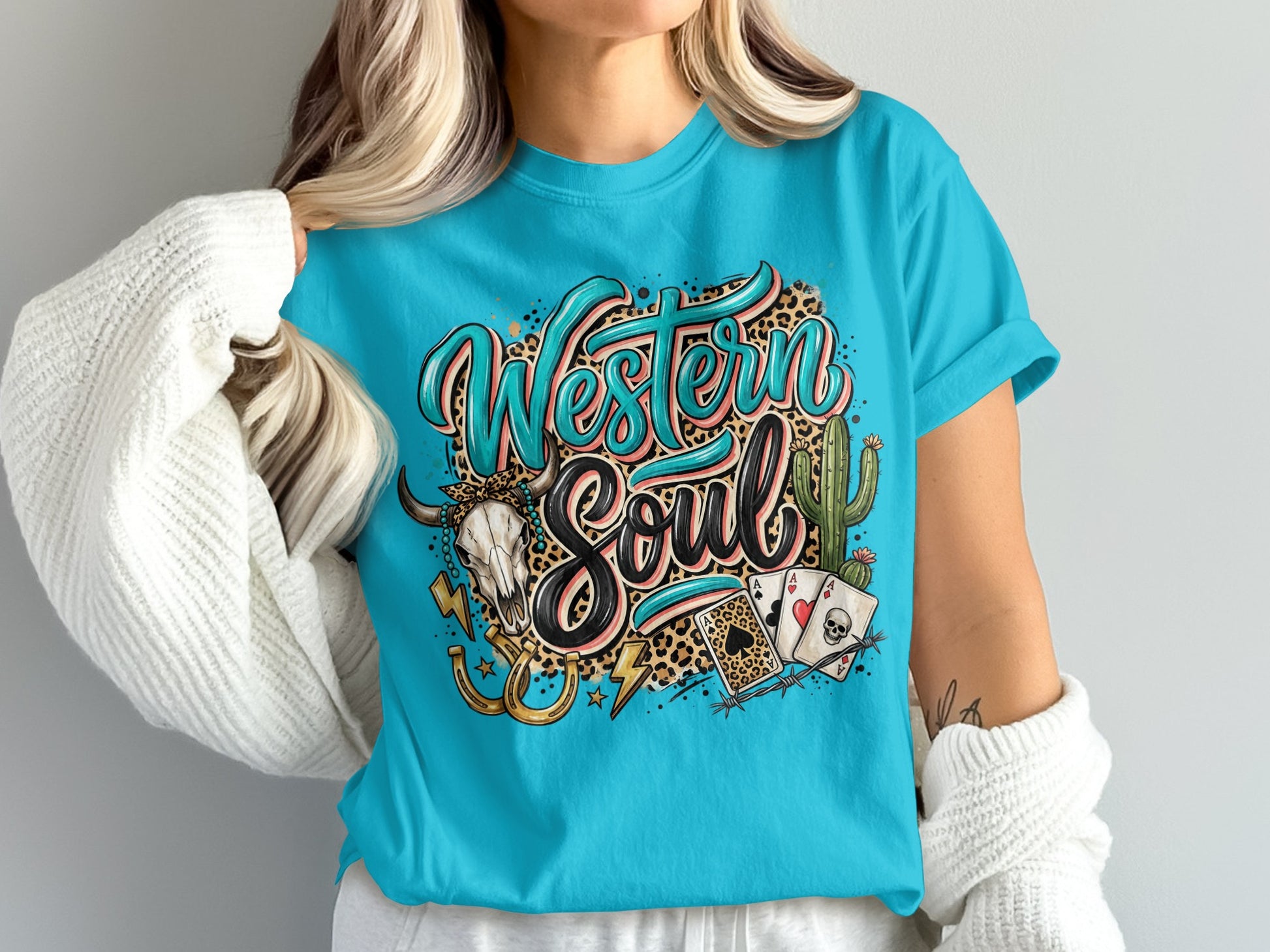 Teal t-shirt with "Western Soul" design, bull skull, cacti, and cards.