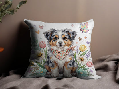 Australian Shepherd puppy wearing bandana surrounded by flowers and butterflies.