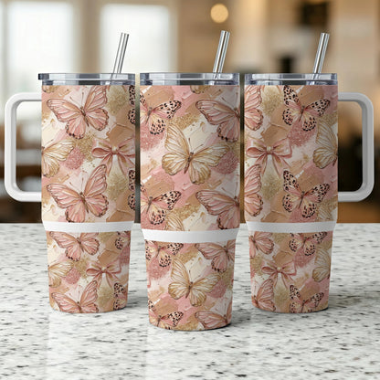 Three tumblers with pink and gold butterfly pattern and white handles.