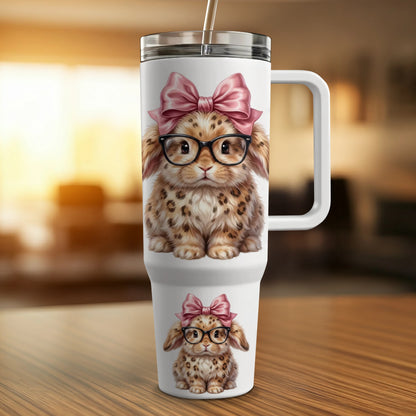 Tumbler with a leopard-spotted bunny wearing glasses and a pink bow.