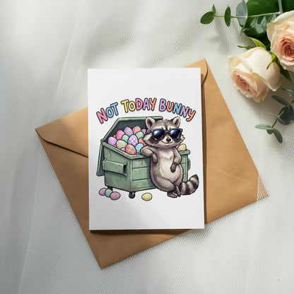 Card with raccoon wearing sunglasses in a dumpster full of Easter eggs.