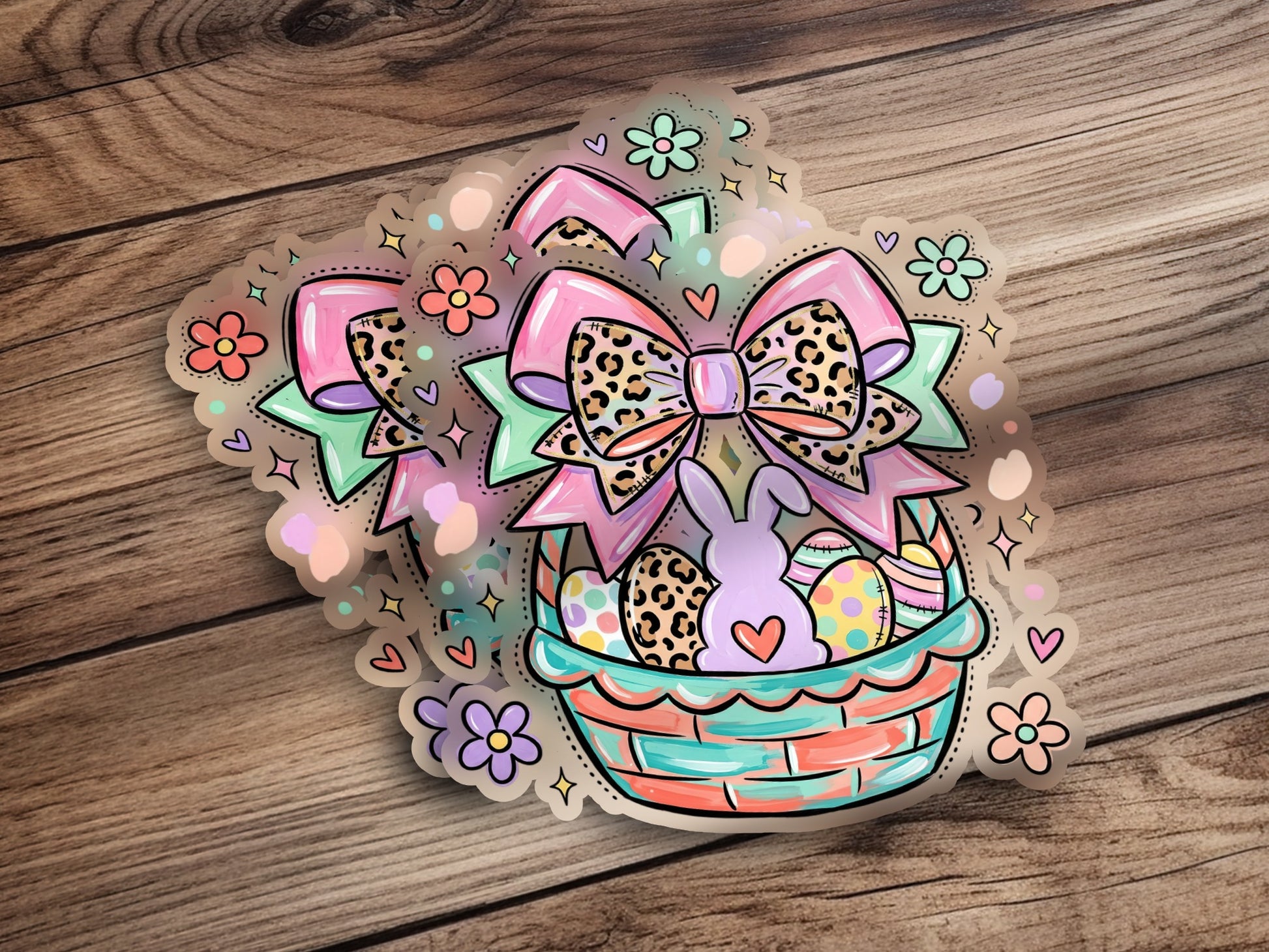 Easter basket with bow, bunny, eggs, and flowers on a wooden background.