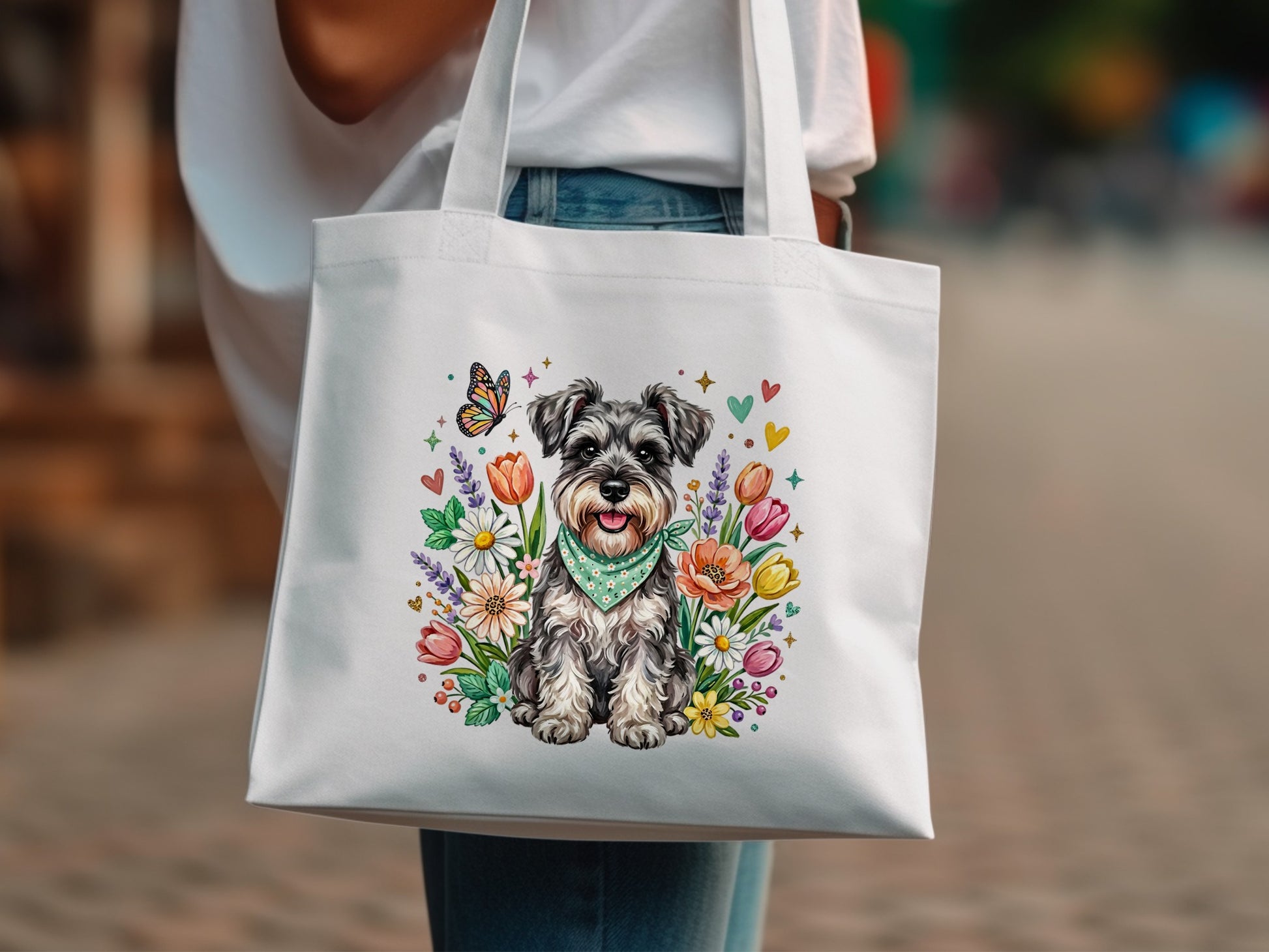 White tote bag with a Miniature Schnauzer surrounded by colorful flowers and a butterfly.