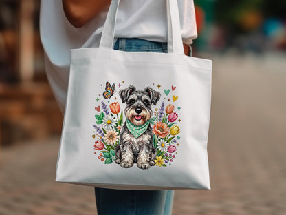 White tote bag with a Miniature Schnauzer surrounded by colorful flowers and a butterfly.