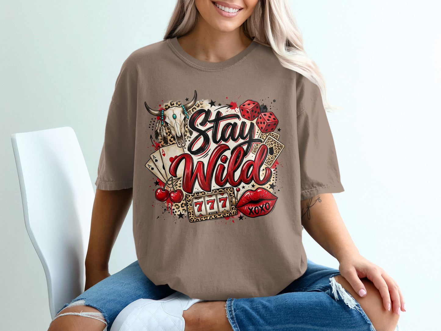 T-shirt with "Stay Wild" graphic featuring casino and western imagery.