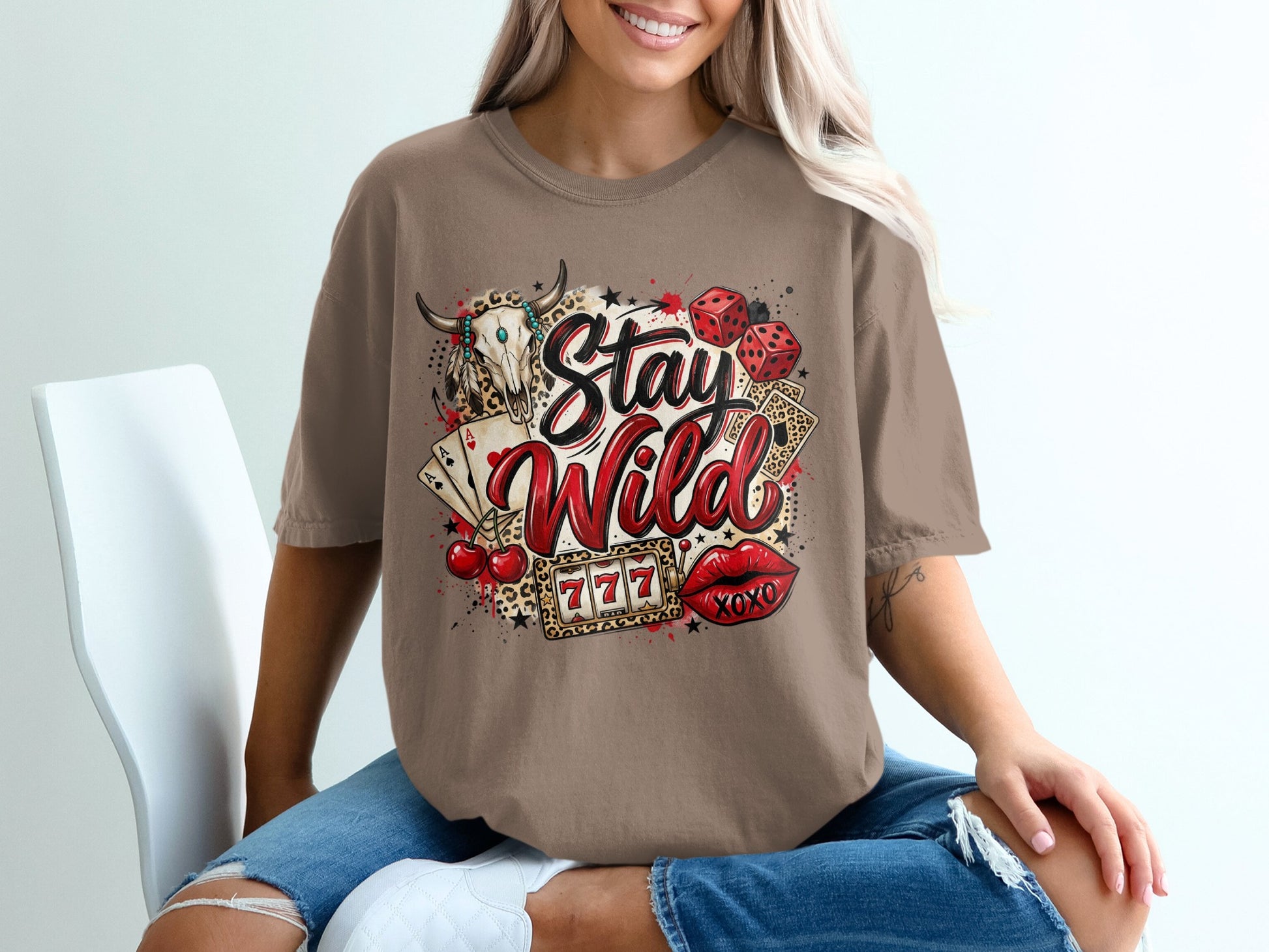 T-shirt with "Stay Wild" graphic featuring casino and western imagery.