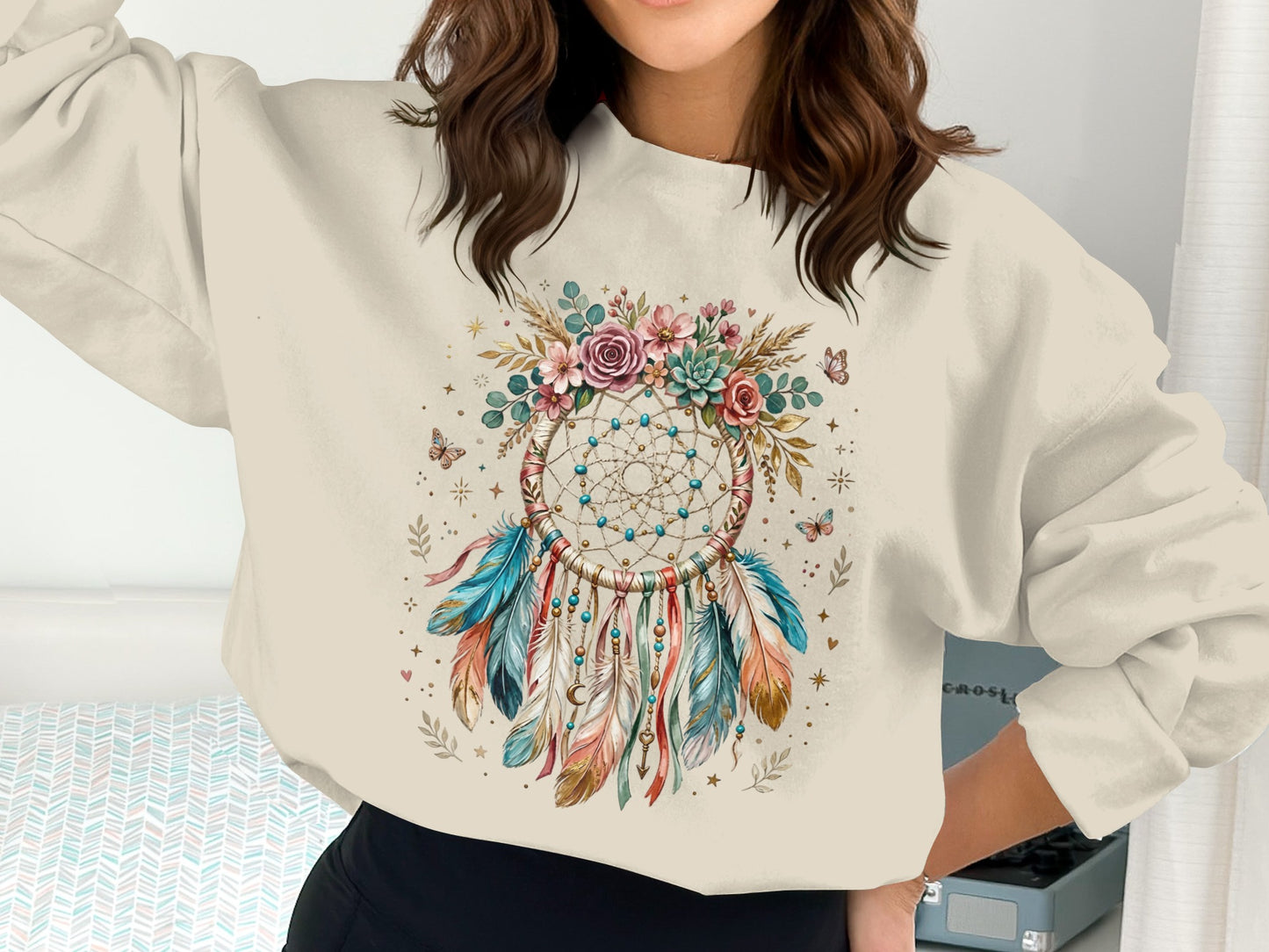 Cream sweatshirt with a colorful dreamcatcher and floral design.