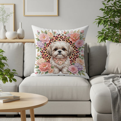 Shih Tzu dog on floral leopard print pillow on a sofa.