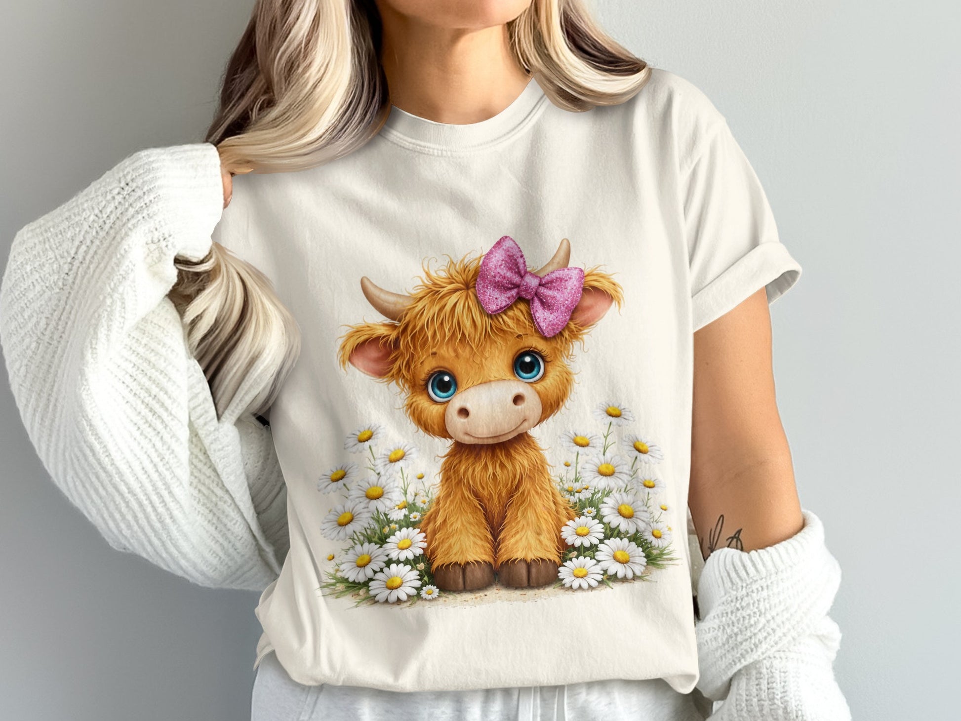 Cartoon Highland cow with blue eyes and pink bow sits in daisies.