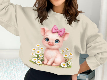 Cute pig with pink bow sitting among daisies on a sweatshirt.