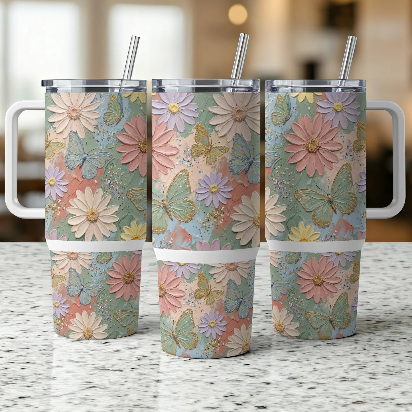 Three tall tumblers with a floral and butterfly pattern.
