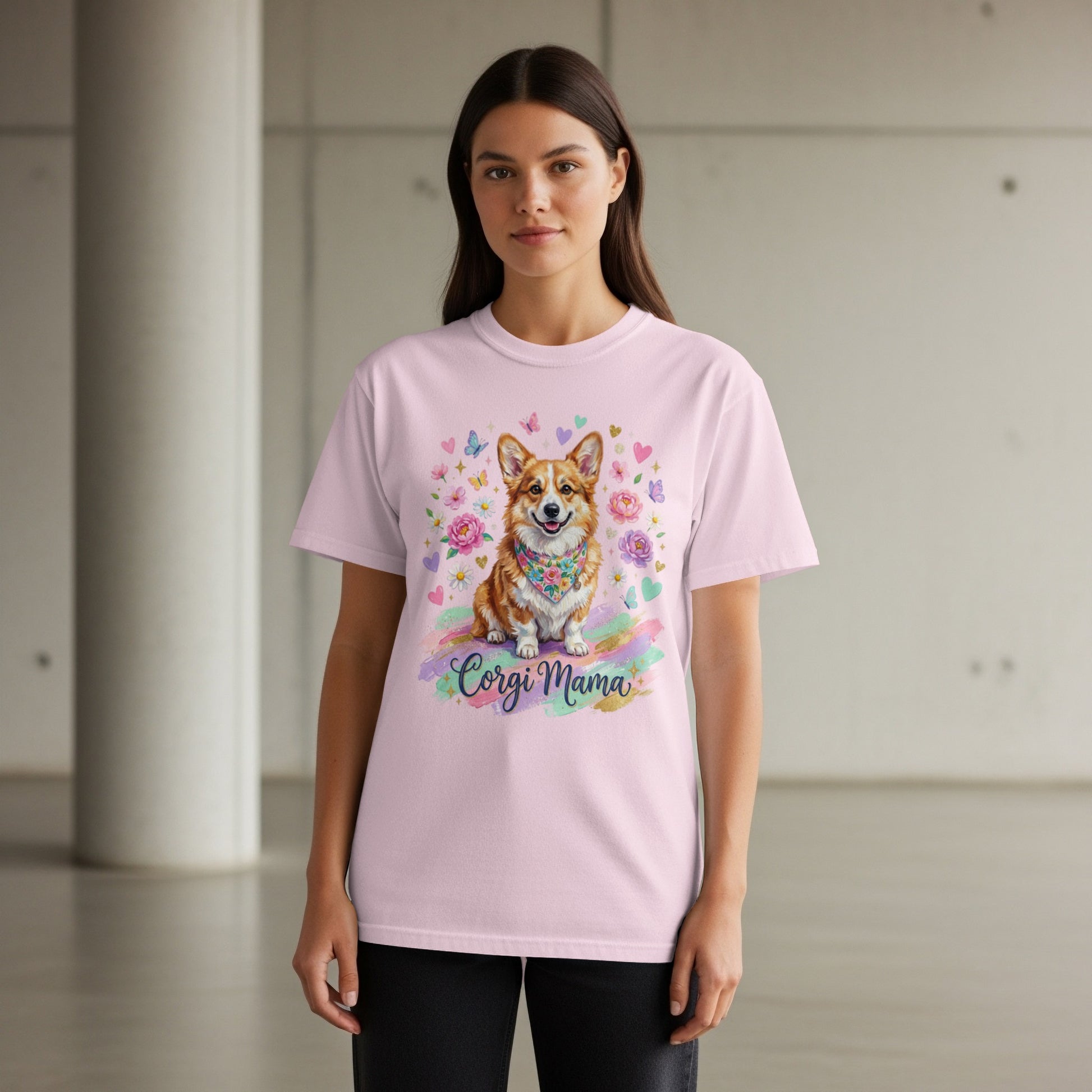 Woman wearing a pink t-shirt with a corgi wearing flowers and the text "Corgi Mama".