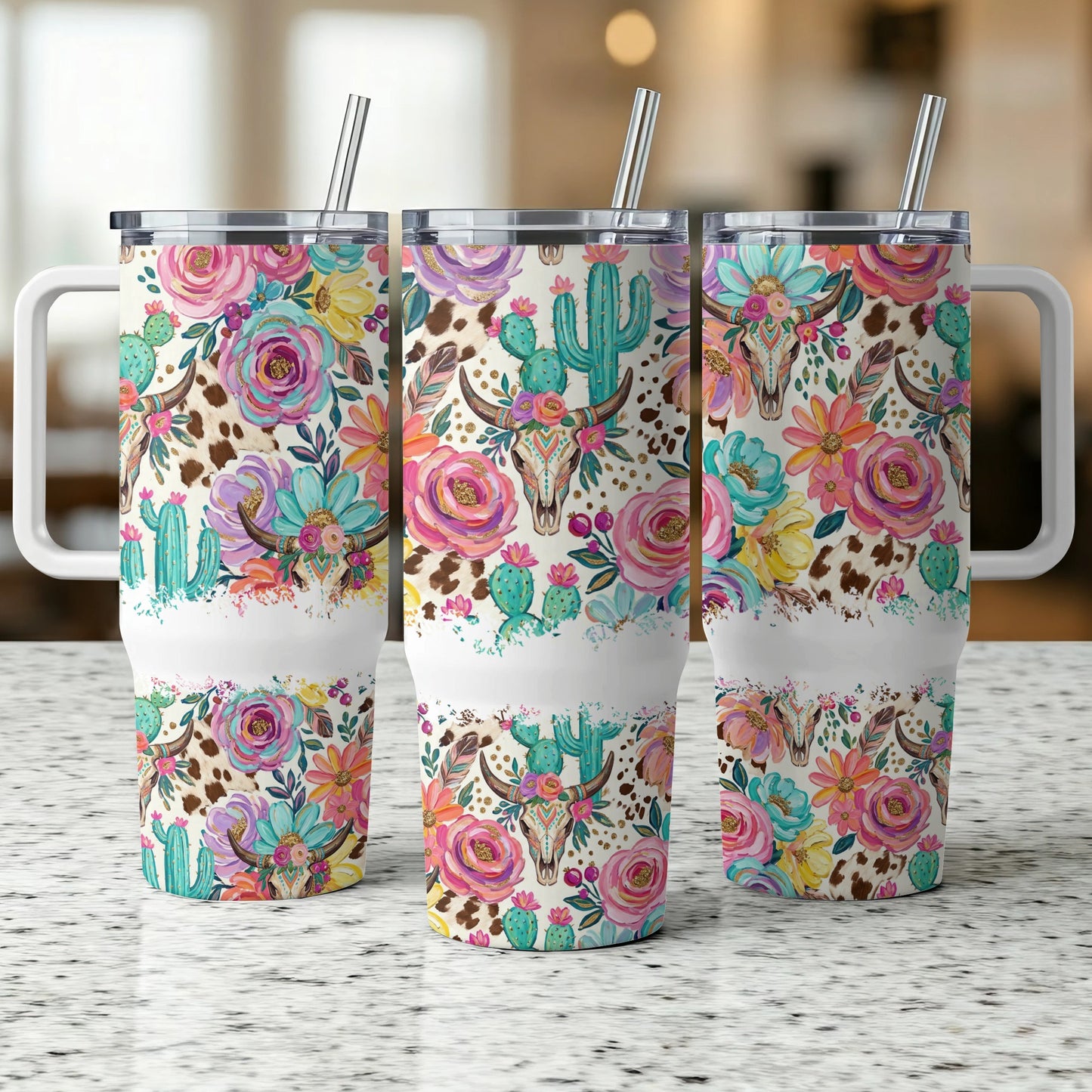 Three tumblers with floral and cowhide patterns and bull skulls.