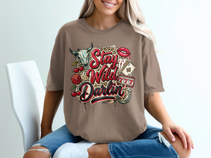 Brown t-shirt with "Stay Wild Darlin'" text, skull, cherries, lipstick, and casino cards.