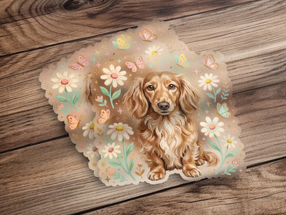 Dachshund puppy surrounded by flowers and butterflies, on a wooden background.