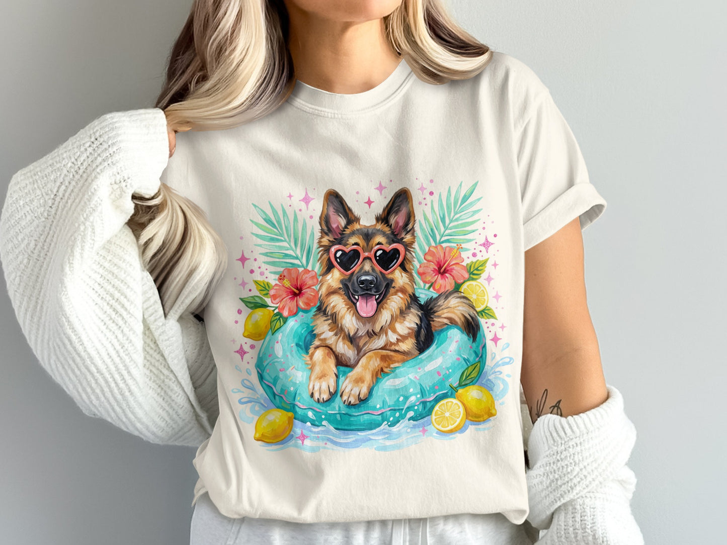 German Shepherd in inner tube with heart sunglasses and lemons.