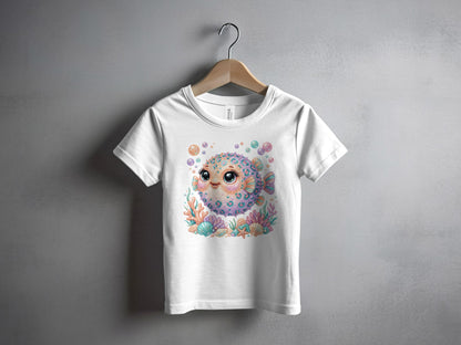 White t-shirt with colorful cartoon pufferfish and coral graphic.